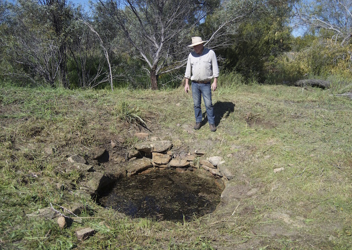 Kim at Burracoppin Well in September 2016 after the surrounds had been cleared.